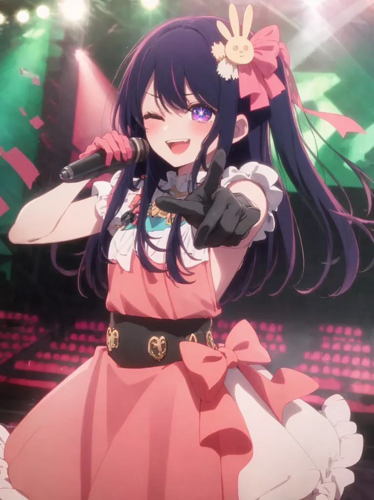 The image shows a young woman with long purple hair and purple eyes. She is wearing a pink dress with a white collar and a large pink bow in her hair. She is also wearing a pair of black gloves and a brown belt with a gold buckle. She is holding a microphone in her right hand and is pointing her left hand at the viewer. She has a playful expression on her face and seems to be enjoying her performance. She is standing on a stage with a large crowd in the background. The stage is lit up with bright lights and there are several spotlights shining on her.