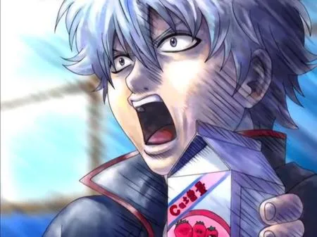 The image contains a young man with short silver hair and gray eyes. He is wearing a black gakuran with a white undershirt. He has his mouth wide open and is shouting while holding a carton of strawberry milk. The background is light blue.