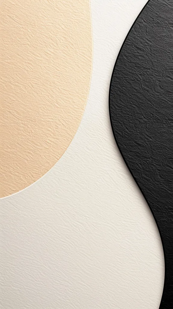 The image shows three textured surfaces. The top left is a soft beige, the bottom right is a smooth black, and the bottom left is a textured white. The shapes of the surfaces create a contrast of colors and textures.
