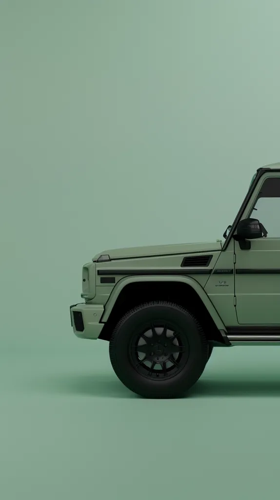 The image shows a green SUV against a green background. The vehicle is facing the left and only the front quarter of the vehicle is visible. The SUV has black tires with black rims and the side of the vehicle has black accents. The picture has a minimalist aesthetic and a shallow depth of field.