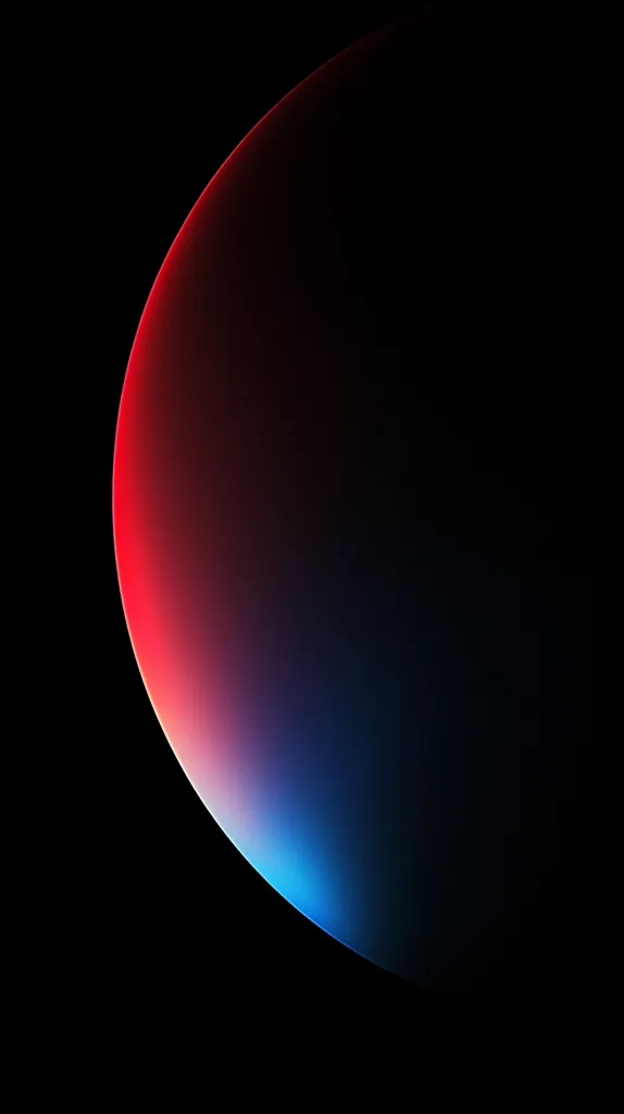 The image shows a large, round, glowing object against a black background. The object is partially obscured, but its curved shape and gradient of color are visible. The object's color transitions from red at the top to blue at the bottom, creating a striking contrast. The image evokes a sense of mystery and wonder.