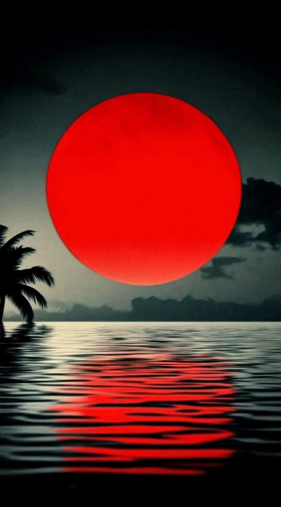A large, vibrant red circle, resembling a sun or moon, dominates the sky above a calm body of water. A single palm tree stands on the shoreline, its silhouette contrasting against the red celestial body. The water reflects the red glow, creating a mesmerizing mirrored effect.  The overall scene evokes a sense of tranquility and mystery.