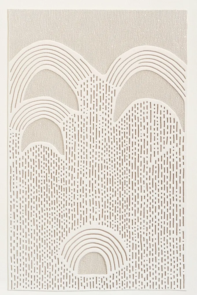 The image is a minimalist abstract design in shades of beige and white. It features a series of curved, arched lines arranged in a layered pattern, creating the illusion of a landscape or a series of overlapping shapes. The background is textured with tiny vertical lines, adding visual depth and interest. The design is simple yet elegant, evoking a sense of calm and serenity.