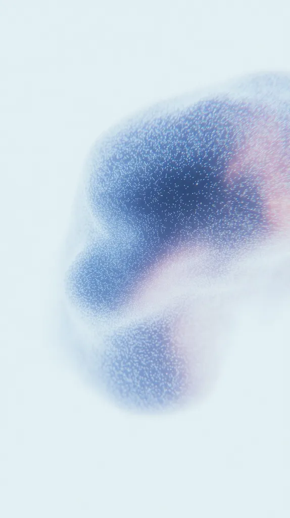 The image shows an abstract, ethereal form resembling a nebula or cloud. It's predominantly light blue and white, with subtle hints of pink.  The form is textured, appearing granular or composed of tiny particles.  It's softly lit, creating a sense of lightness and airiness against a bright, almost blank background. The overall impression is one of delicate beauty and subtle movement.