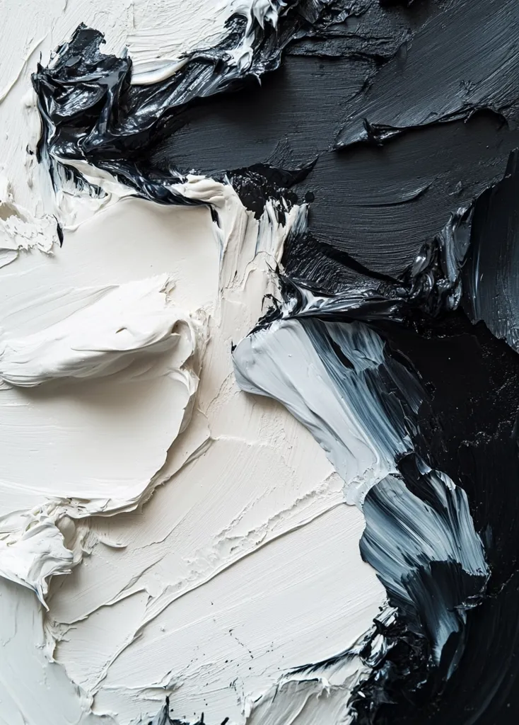A close-up shot reveals a dynamic interplay of thick, impasto paint strokes in stark black and white.  The paint is applied with visible texture and movement, creating a swirling, abstract effect.  The contrast between the dark and light creates a dramatic visual tension, highlighting the artist's expressive technique.  The image is an exploration of texture and form through bold color choices.