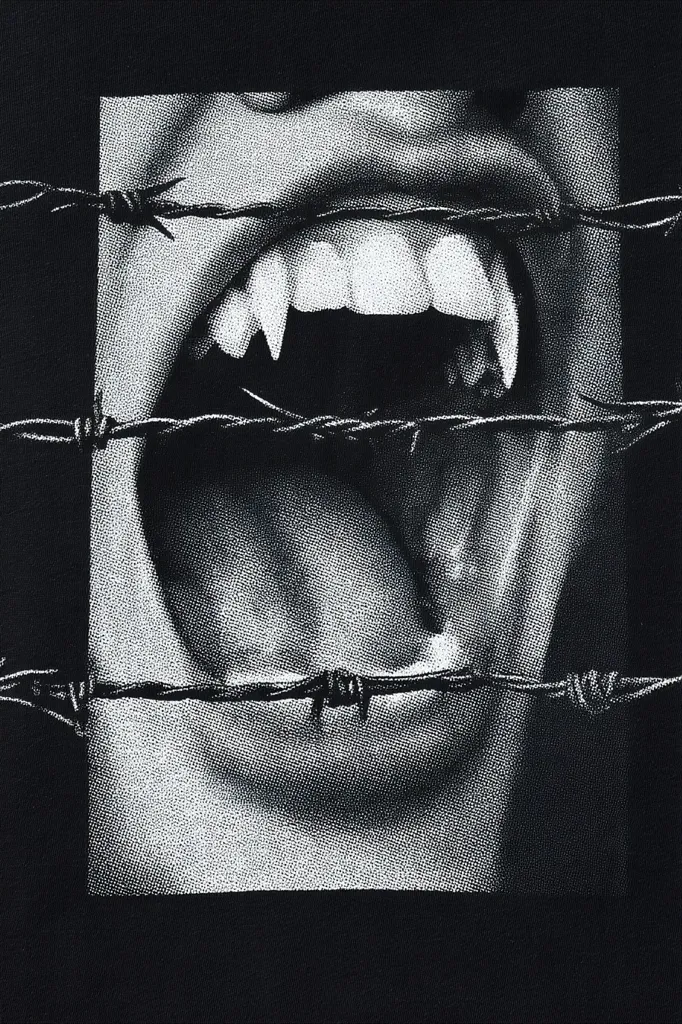 A black and white image depicts a vampire's mouth, fangs bared in a menacing snarl.  The mouth is framed by barbed wire, creating a stark contrast between the sensual and the dangerous. The image is high contrast, with deep blacks and bright whites, giving it a gritty, graphic novel feel. The overall effect is one of edgy, gothic style.