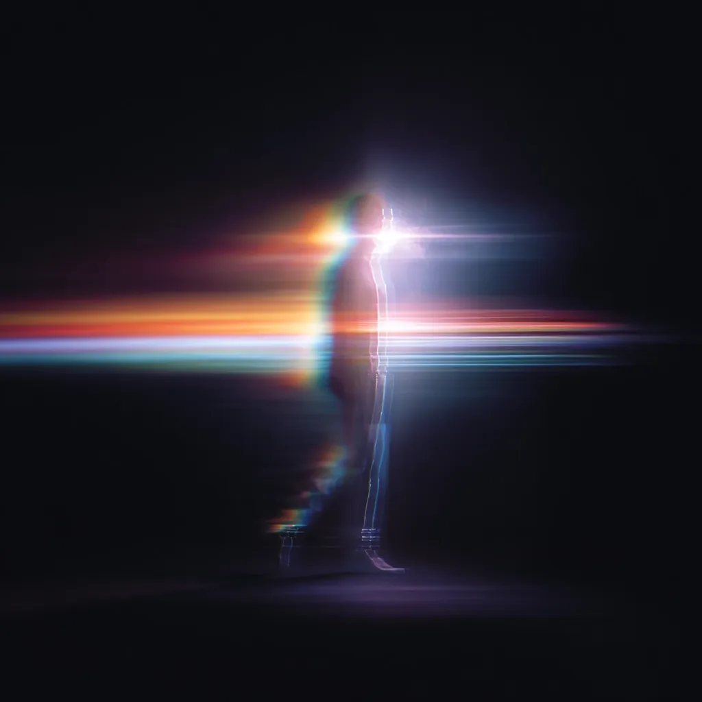 A stylized figure, seemingly walking, is bathed in vibrant, multicolored light streaks against a black backdrop. The light effects create a sense of motion and energy, blurring the figure's form while highlighting its silhouette.  The overall impression is one of speed, dynamism, and perhaps a journey through a surreal or futuristic landscape.