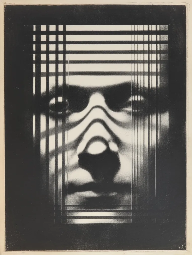 A black and white image shows a blurred face partially obscured by a grid pattern, suggestive of blinds or a jail cell.  The face is centrally positioned, its features indistinct yet expressive. The contrast between light and dark creates a dramatic, almost haunting effect, emphasizing the anonymity and confinement implied by the grid. The style is reminiscent of photomontage or a screen print, with a strong graphic quality.