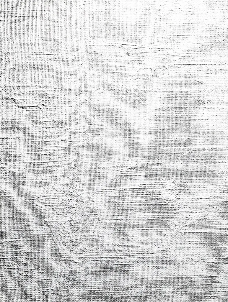 The image shows a close-up view of a textured surface, possibly a canvas or similar material.  The texture is predominantly white with subtle variations in shade and tone, creating a sense of depth and movement.  Visible brushstrokes or tooling marks suggest an artistic application of material, hinting at an impasto style. The overall impression is one of raw, unfinished texture.