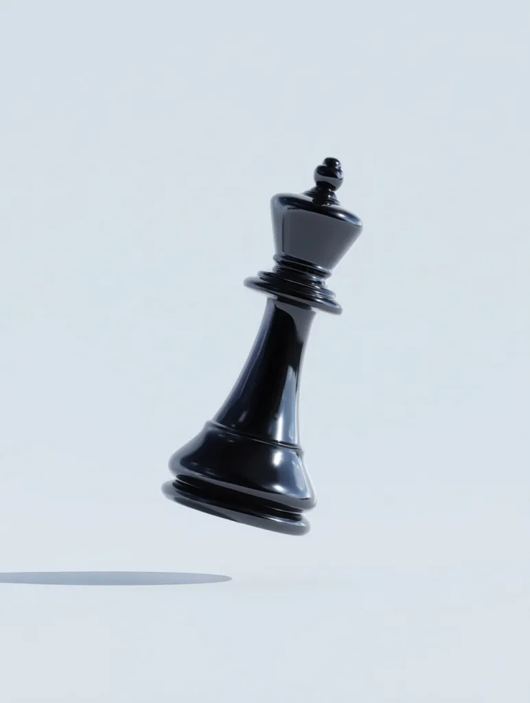 A black chess king piece is shown falling against a plain white background.  The king is highly polished, reflecting light. Its shadow is cast below, slightly out of focus. The image suggests power, strategy, or the end of a game. The minimalist setting emphasizes the chess piece's form and symbolic weight.
