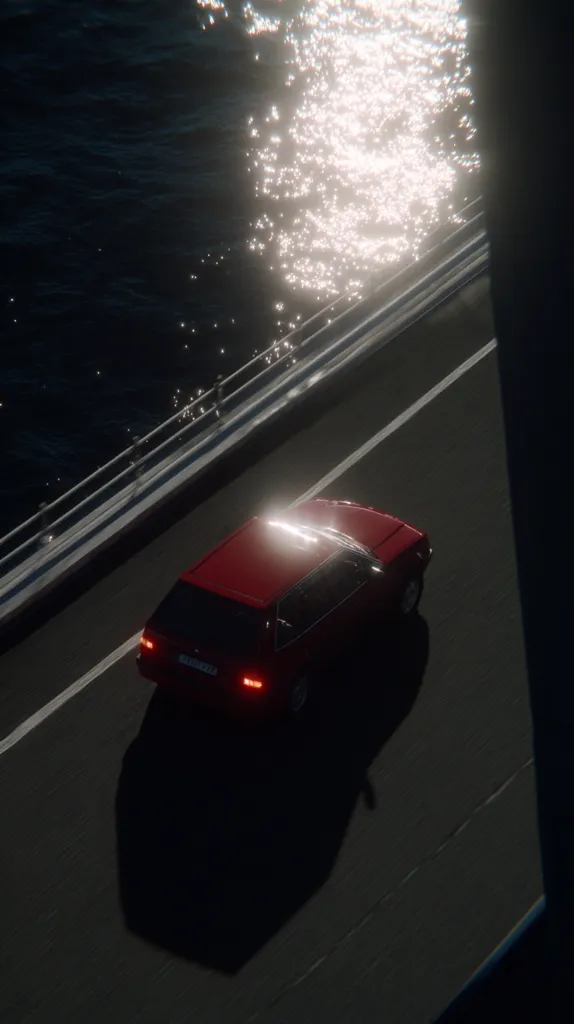 A red car drives along a highway beside a body of water.  Sunlight glints off the water's surface, creating a sparkling effect. The scene is viewed from a high angle, emphasizing the car's solitary journey. The dark, moody atmosphere contrasts with the bright reflection on the water. The road is empty, giving a sense of isolation and calm.