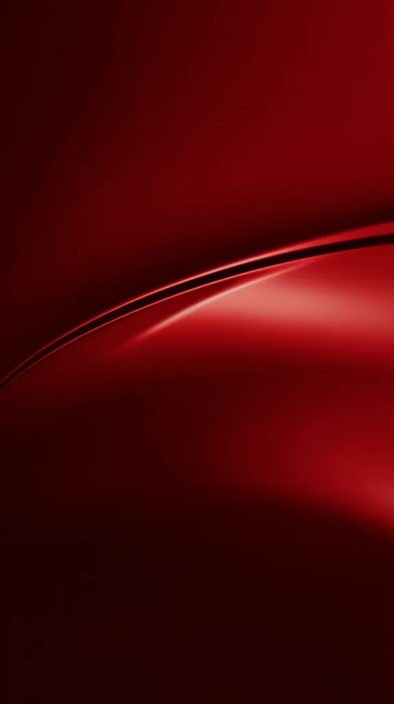 The image showcases a close-up view of a deep red surface, possibly a car's body.  A subtle curve runs across the frame, highlighting the smooth, glossy texture and rich color.  The lighting creates a gradient effect, with darker shades at the edges and a brighter, more intense red in the center.  The overall impression is one of sleekness and sophistication.