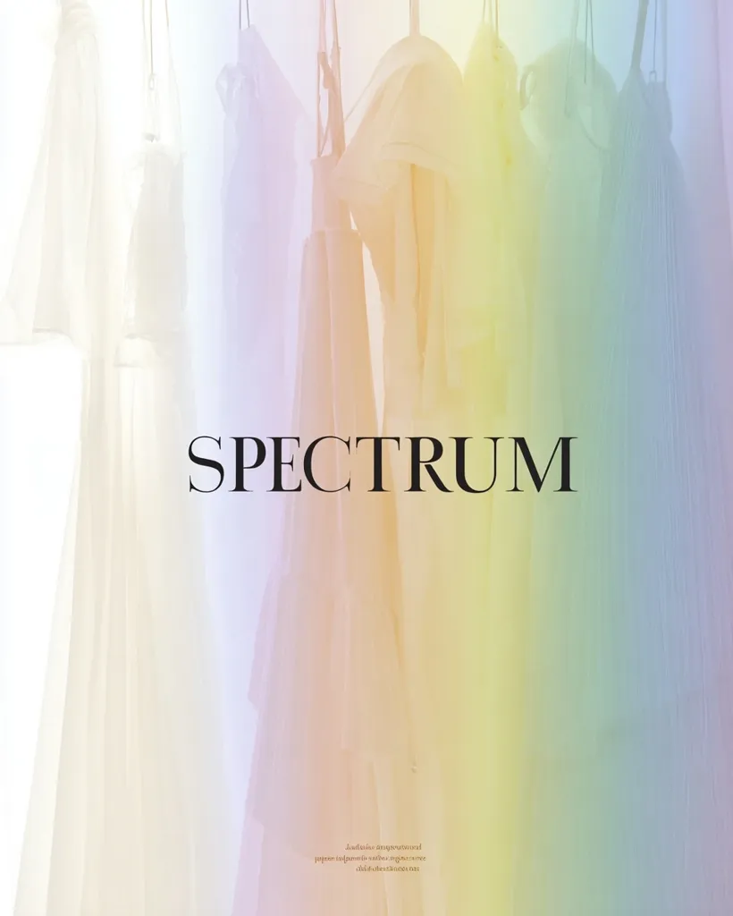 Several sheer garments in pastel rainbow hues hang on hangers.  The word "SPECTRUM" is prominently displayed in a simple black font across the center.  The image evokes a feeling of lightness and ethereal beauty, suggesting a fashion or design concept focused on a spectrum of colors. The subtle, blurry quality adds to the dreamy aesthetic.