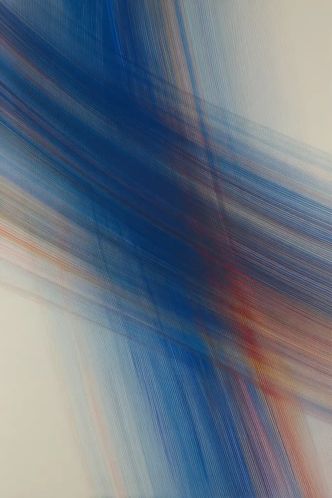 The artwork is an abstract composition dominated by diagonal lines of varying thicknesses and hues.  Predominantly blue, the lines blend into lighter, almost beige tones at the edges.  The effect is one of movement and depth, creating a dynamic interplay of color and texture.  The thin, parallel strokes suggest a sense of speed or energy, leaving the viewer with a feeling of fluidity and motion.